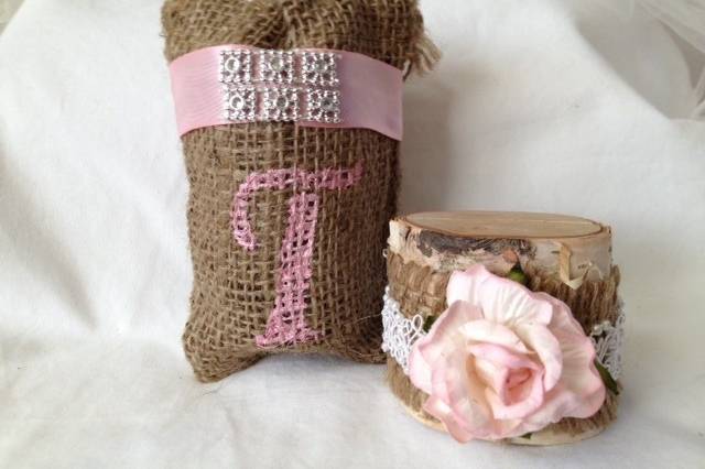 Perfectly rustic! These customized burlap bags have two functions! Not only do they hold your guests party favors they also add color and creativity to you table! Your guests will be amazed at the attention to detail. We are offering these bags in two styles: Country Bling (with pink ribbon and bling detail) or Pure Country (lace ribbon detail and matching roses).All the bags are 3-1/2'' x 5''. We can customize any bag to fit your needs. Your choice of lettering and color. Don't see a color that matches your decor? Send us an email and we will be happy to work with you on perfecting your bags.Sold in sets of 20 custom bags for $50.00We also offer matching place card holders so please view our entire shop.Because we are working with burlap bags, there will be some slight irregular shapes.Keep your party rustic chic!Be sure to visit www.etsy.com/shop/tuttirosedesigns to see our entire collection.
