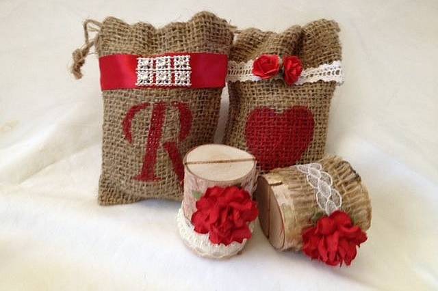 Perfectly rustic! These customized burlap bags have two functions! Not only do they hold your guests party favors they also add color and creativity to you table! Your guests will be amazed at the attention to detail. We are offering these bags in two styles: Country Bling (with red ribbon and bling detail) or Pure Country (lace ribbon detail and matching roses).All the bags are 3-1/2'' x 5''. We can customize any bag to fit your needs. Your choice of lettering and color. Don't see a color that matches your decor? Send us an email and we will be happy to work with you on perfecting your bags.Set of 20 custom burlap bags - $50.00We also offer matching place card holders so please view our entire shop.Because we are working with burlap bags, there will be some slight irregular shapes.Keep your party rustic chic!Be sure to visit www.etsy.com/shop/tuttirosedesigns to see our entire collection.