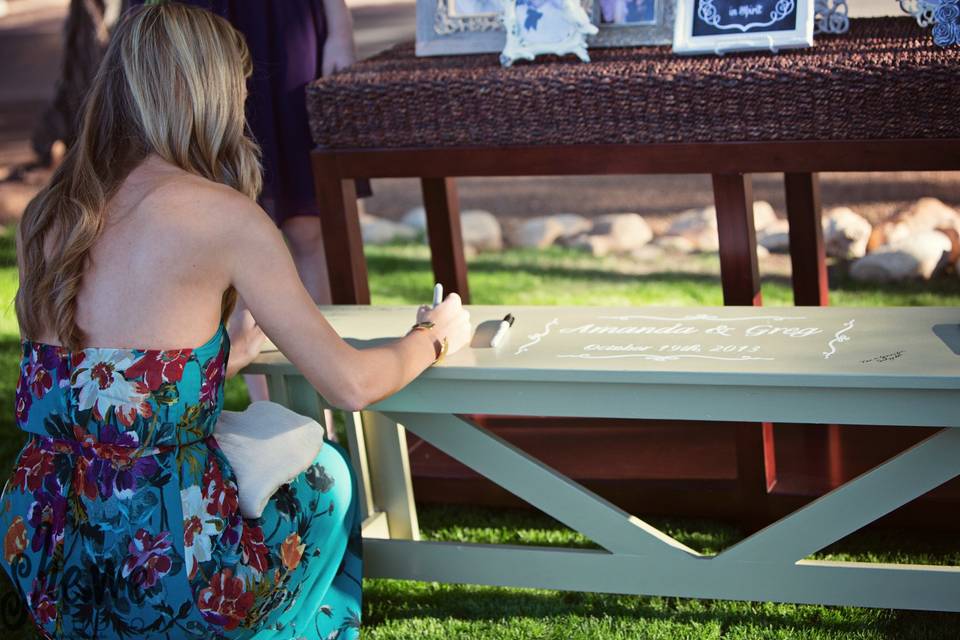 Instead of a tradition guest book Amanda's friend made this bench for people to sign. Now they have an amazing piece of furniture that will be on display all the time.