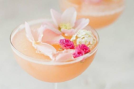 Fresh flowers floated in a champagne sangria