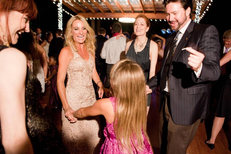 The couple dancing with a kid