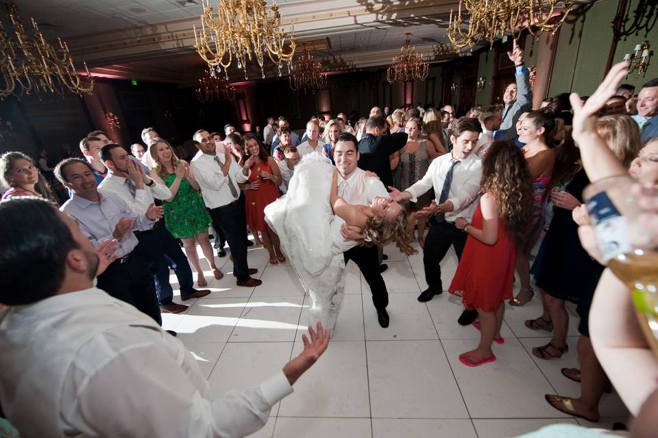 Couple dancing with beloved guests