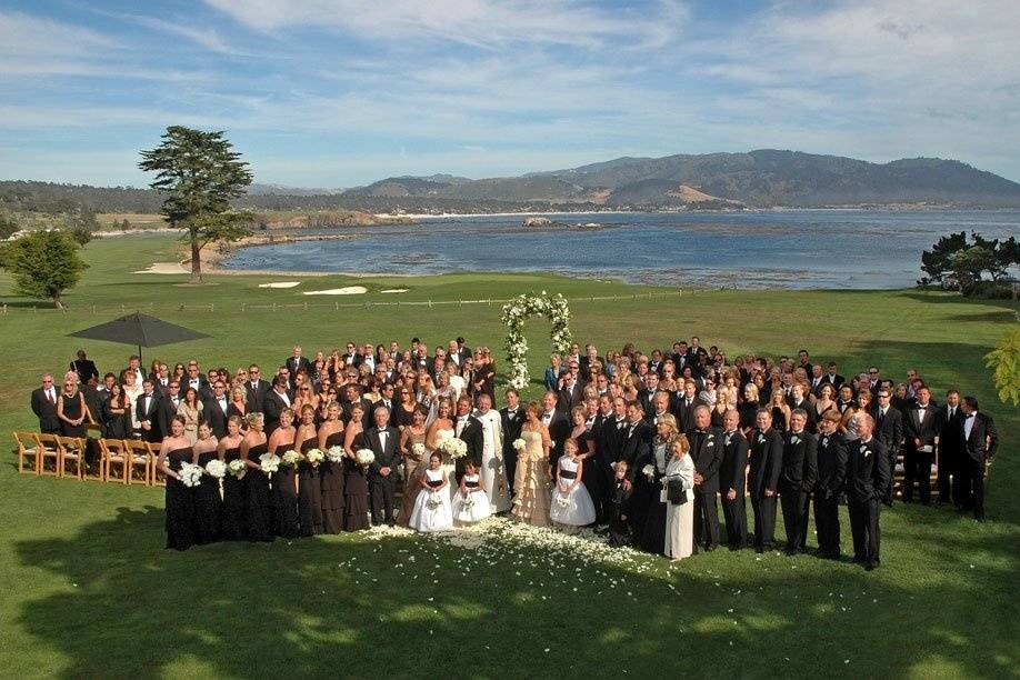 The 18th Lawn ceremony site at The Lodge at Pebble Beach with the famous 18th hole of the Pebble Beach Golf Links in the background.