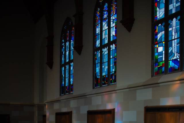 Bride and groom in chapel stai