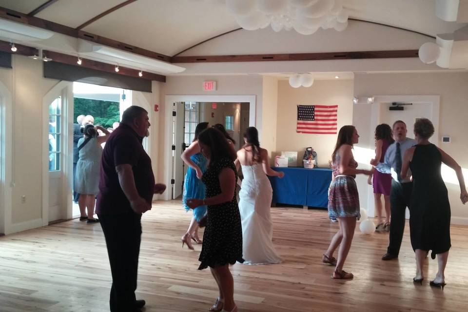 Bride and guests dancing