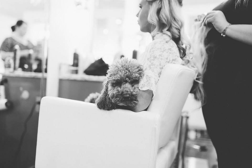 Bride with her dog at the styling station