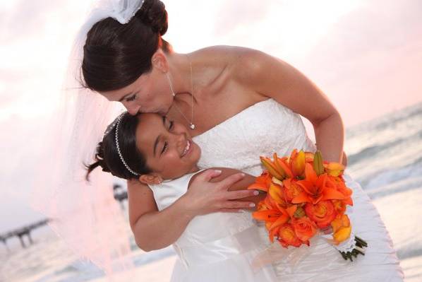 Bride kissing child