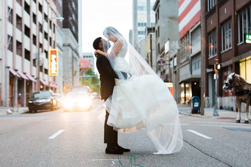 Lifting her in the street