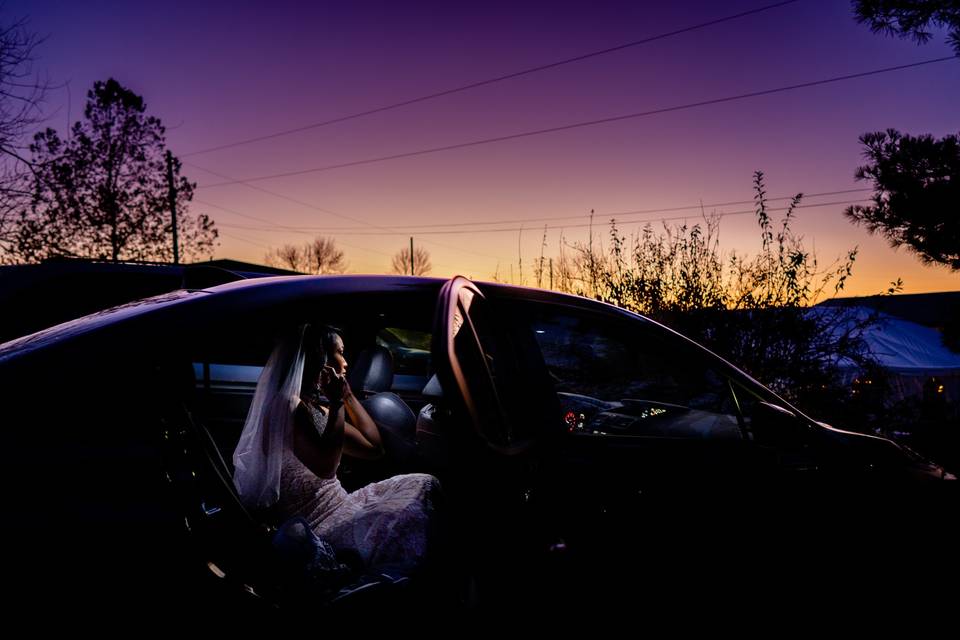Bride gets ready in the car