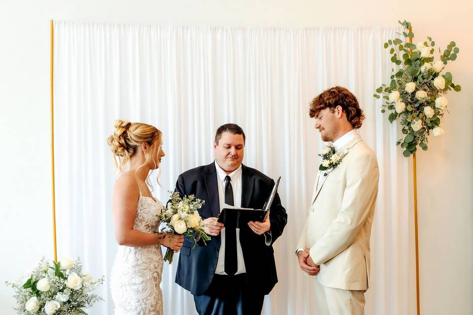 Indoor ceremony setup with mod