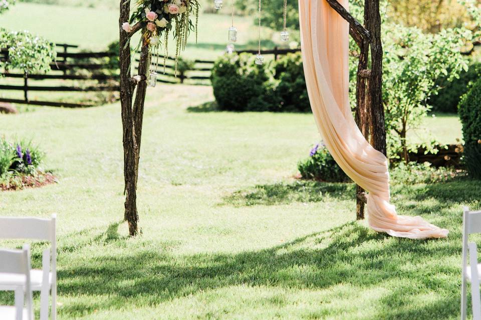 Sash and floral arch decor