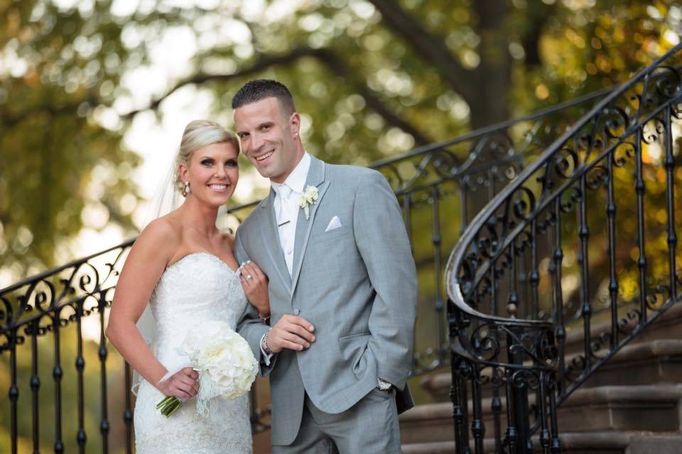 Newlyweds by the staircase