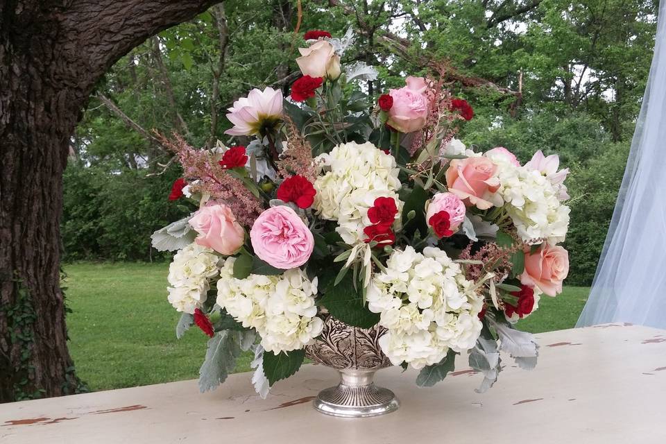 Large vase and floral arrangement