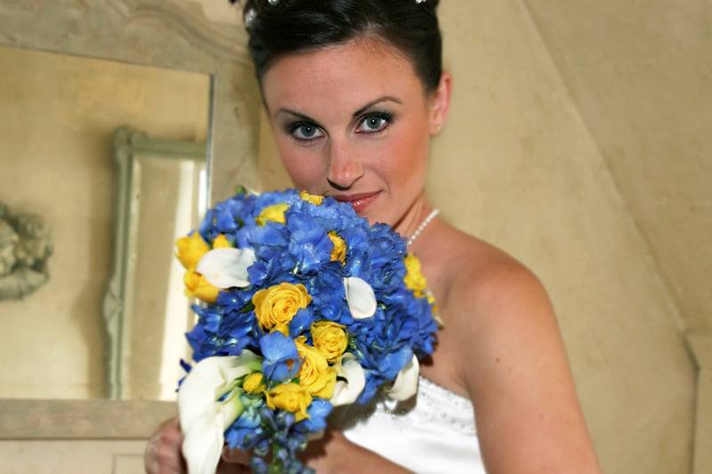 Bride showing off her colorful bouquet.