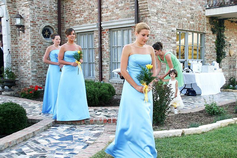 Bridesmaids leading the way to the ceremony.