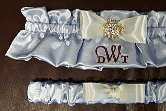 Something blue monogram bridal garter set with tuxedo bow.  Bridal garter has large rhinestone button and monogram.