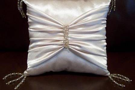 Luxurious crepe back satin ring bearer pillow with corner Swarovski crystal tassels and gathered crepe back satin cinched with strands of Swarovski crystals