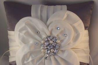 Gorgeous charcoal satin shantung ring bearer pillow with large ivory satin flower accented with bold Swarovski rhinestones