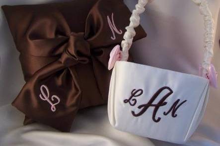 Chocolate satin love knot pillow with embroidered initials.  Coordinating monogram flower girl basket