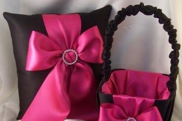 Bold and beautiful custom ring bearer pillow and flower girl basket in black satin with hot pink satin bow accented with center rhinestone buckle.