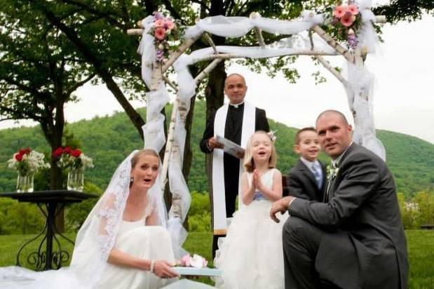 Newlyweds with the kids and the officiant