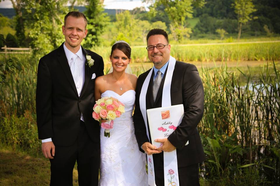 Officiant and the newlywed couple