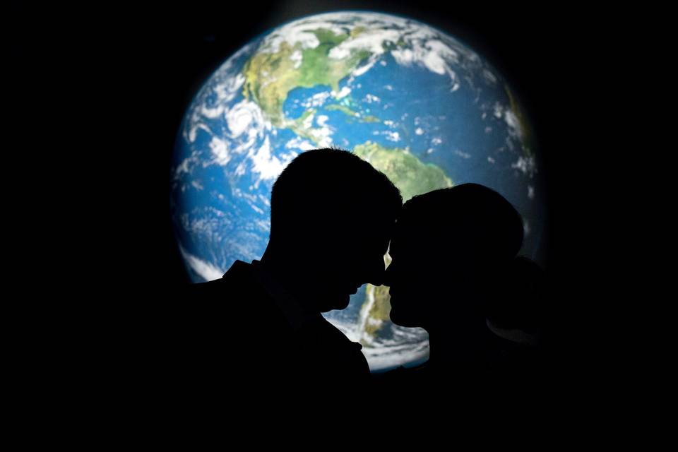 Couple w/ backlit Earth
