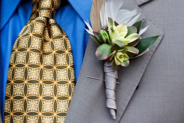 Succulent boutonniere with succulents and feather -- available any season.