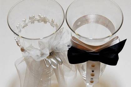 Bride and groom drink glasses