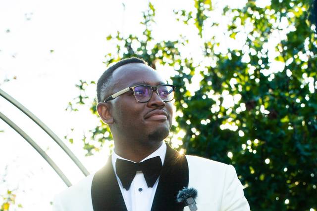 Groom in white tuxedo