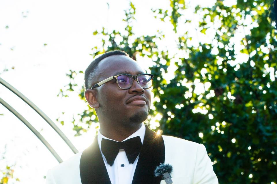 Groom in white tuxedo
