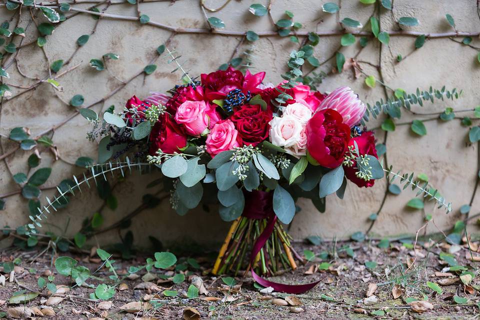 Oversized bouquet designed with peonies roses, protea, and lots of eucalyptus!