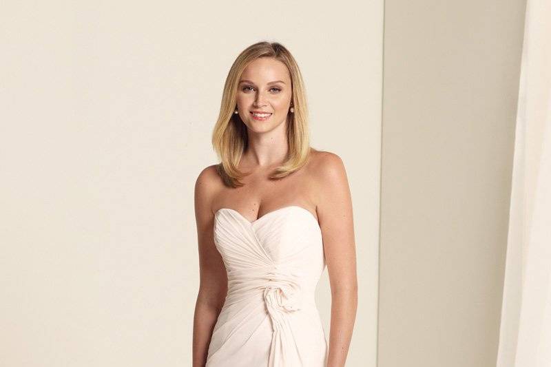 BY11341
Strapless chiffon A-line gown with sweetheart neckline, richly draped bodice finished with a twisted rosette at side waist and cascading ruffle down skirt, corset back. Removable straps included. Available in all chiffon colors.