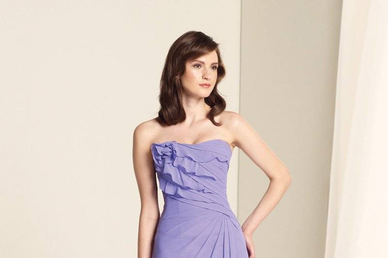 BY11344
Strapless chiffon A-line gown with softly curved neckline, asymmetrically ruched bodice trimmed with ruffles and rosette accent, corset back, side draped skirt. Removable straps included. Available in all chiffon colors.