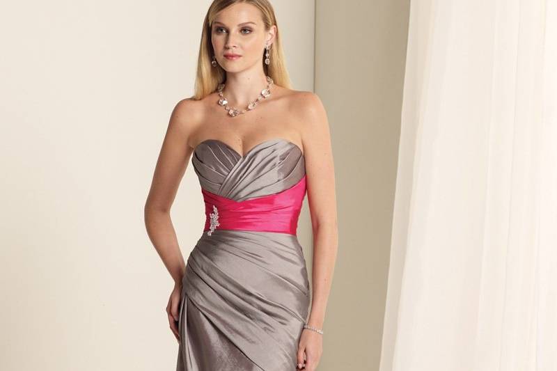 BY11359
Strapless taffeta A-line gown with sweetheart neckline, Empire band with side brooch detail, directionally draped bodice with asymmetrically dropped waistline and corset back. Removable straps included. Available in all taffeta colors.