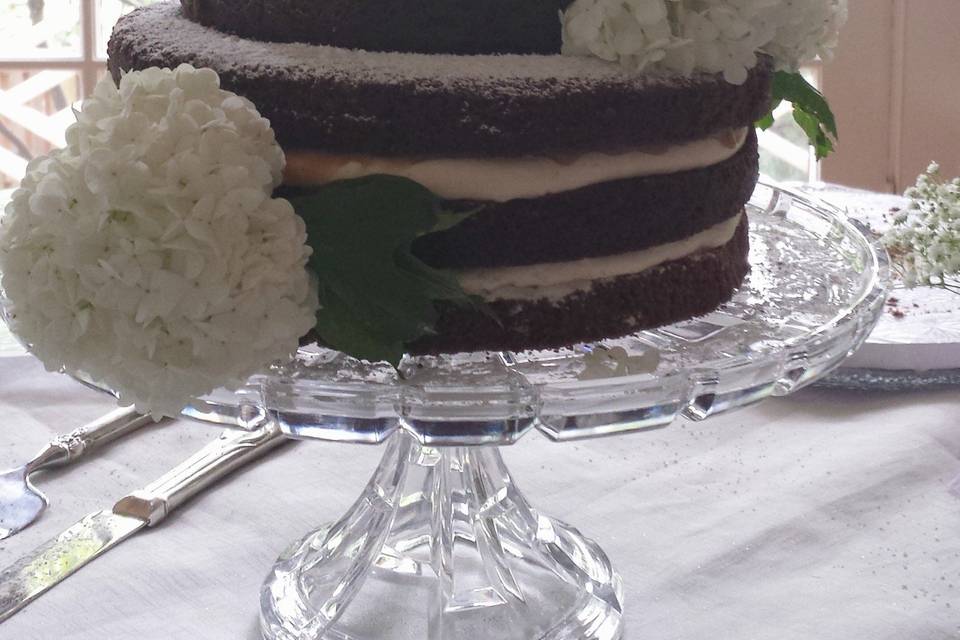 Gluten free buttercream wedding cake with lace piping and monogram