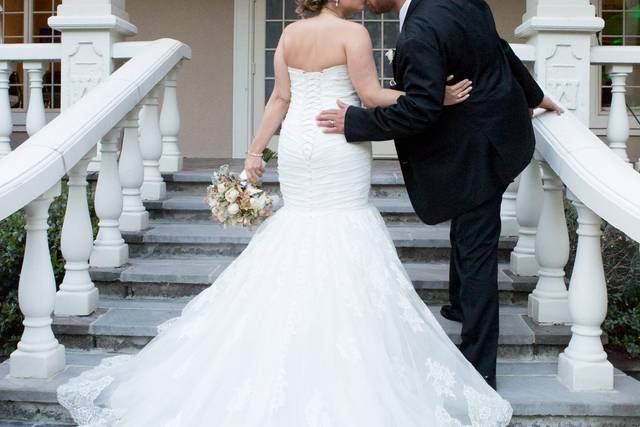 Newlyweds kiss on the stairs