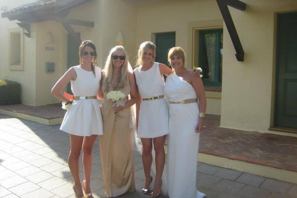 Bride and Bridesmaids, grecian inspired bridesmaids dressings, decorated with matching gold belts.