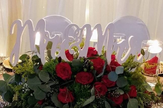 Red roses with champagne satin Linens, Mr & Mrs. Sweetheart table