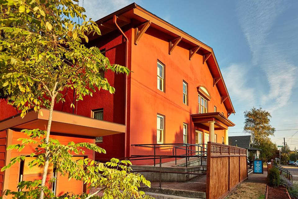 Cerimon House at 5131 NE 23rd Avenue in Portland, Oregon.  The front of the building offers an ADA ramp, a wonderful stairway,  and beautiful trees to welcome guests.