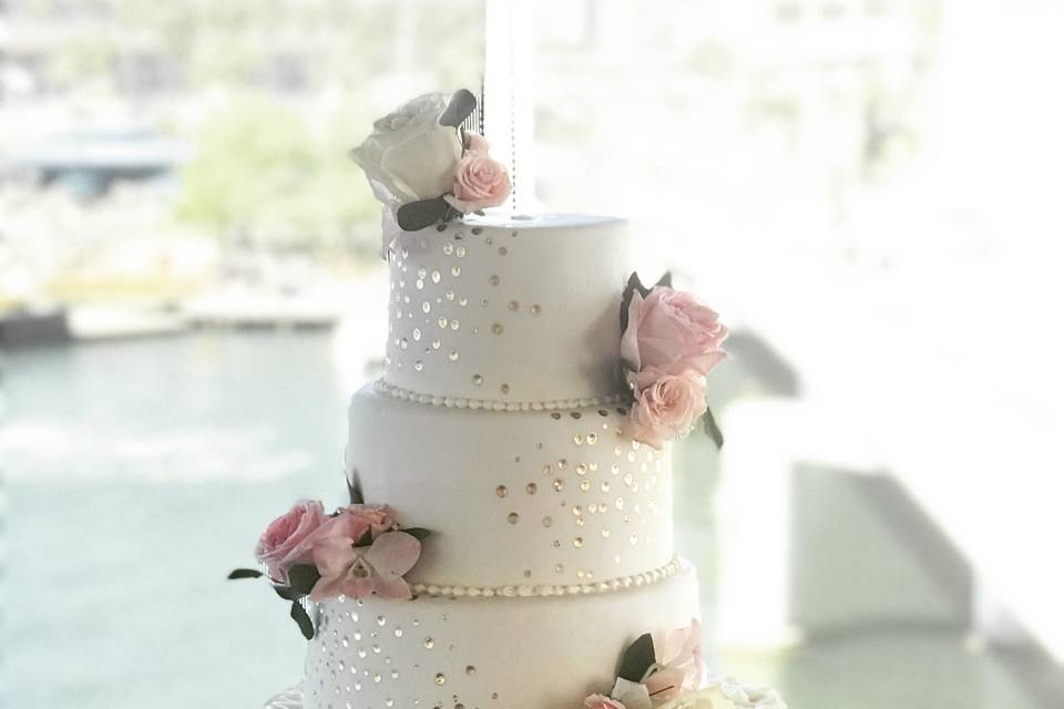 Gold glitter and ruffles wedding cake