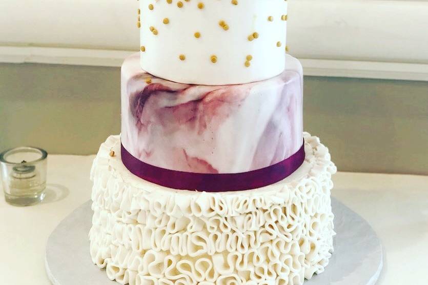 Gold glitter and ruffles wedding cake