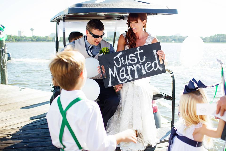 Golf cart send off after this yacht wedding in Destin on the SOLARIS>