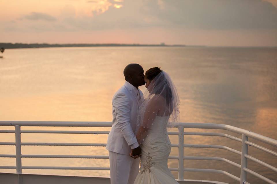 Precious moment on the sky deck during a Sunset Ceremony on the SOLARIS yacht in Destin Fla