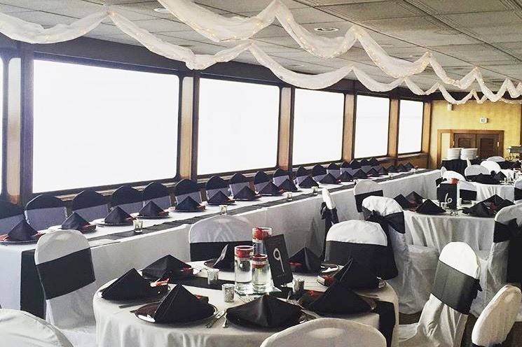 Elegant black and white yacht wedding and reception on the SOLARIS yacht Sandestin Florida overlooking the beautiful waters.