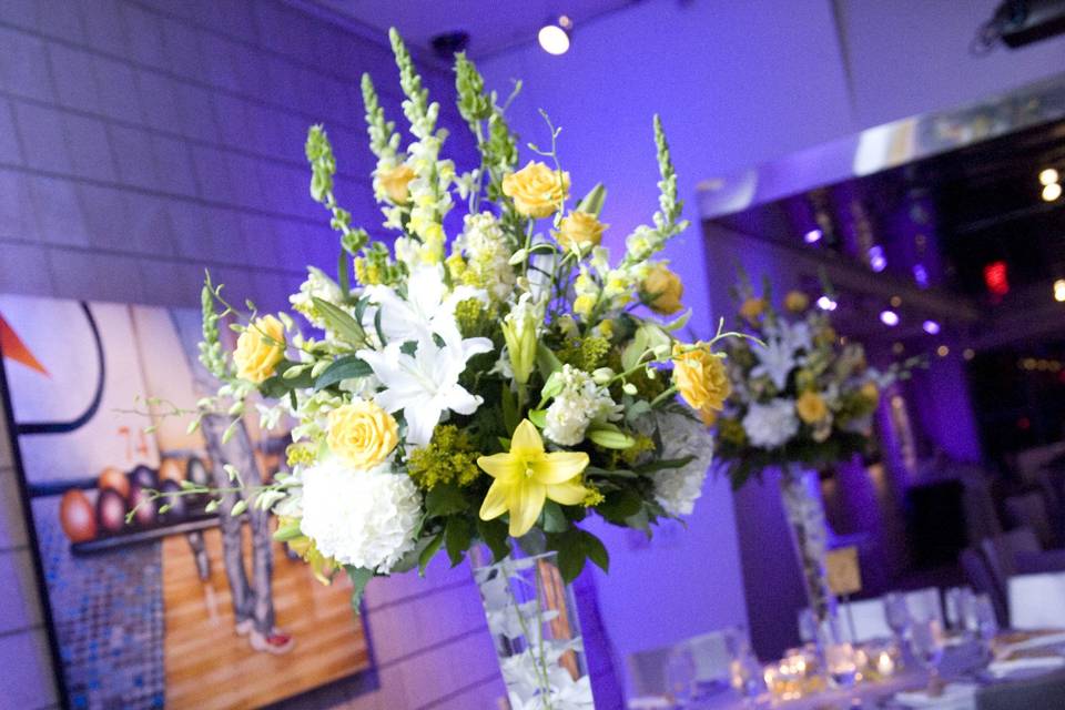 Simple yet elegant ceremony space, four corners designed with curly willow branches, oncidium orchids, yellow and white lilies, yellow snapdragons and yellow roses.