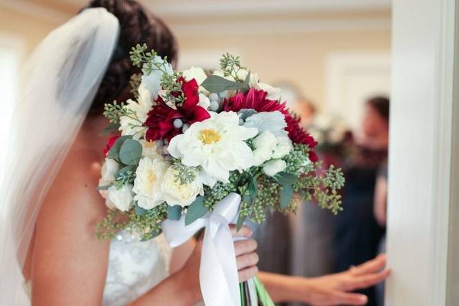 Elegant centerpiece designed with white hydrangea, blush roses and white phalaenopsis orchids.