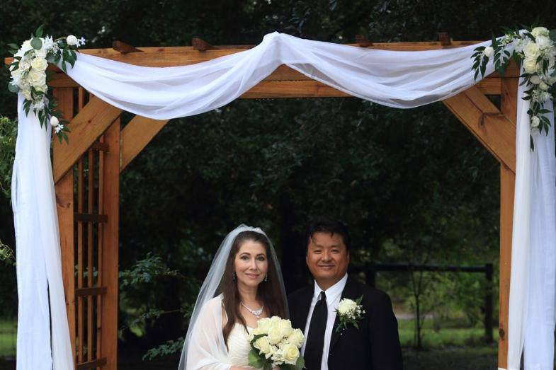 Bride and groom under archway