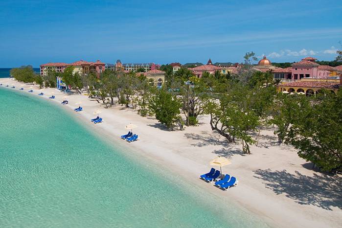 Take a romantic walk on a beautiful 2-mile stretch of secluded white-sand beach at Sandals Whitehouse in Jamaica.  One of our personal favorite beaches!