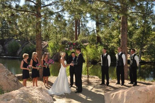 Magnificent ceremony sight set beneath a canopy of trees,overlooking our spring fed pond.Photos compliments of Cascade Photography